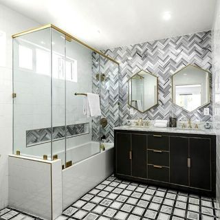 Bathroom with black cabinet glass partition and mirror on wall