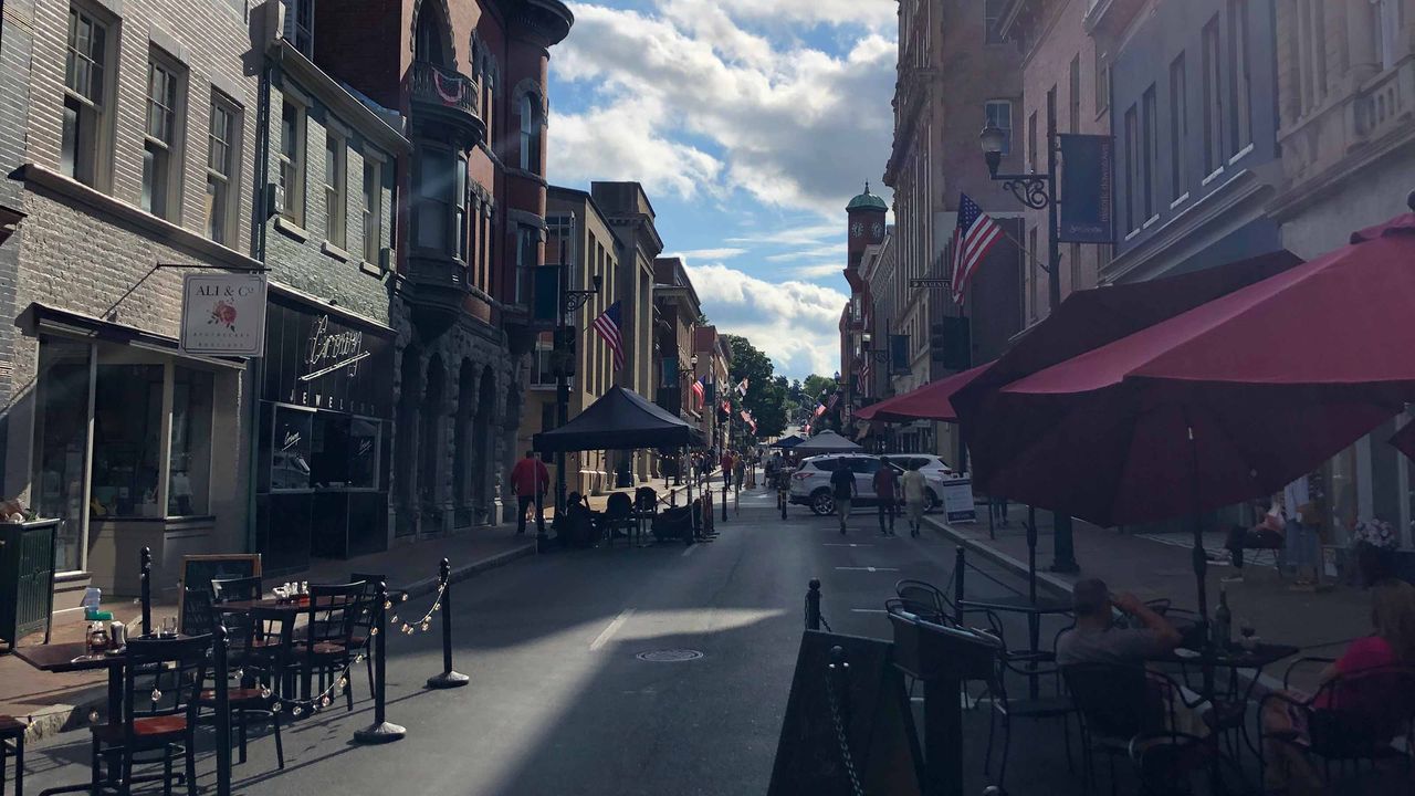 Outdoor dining tables and chairs outside the historic buildings of downtown Staunton, Va.