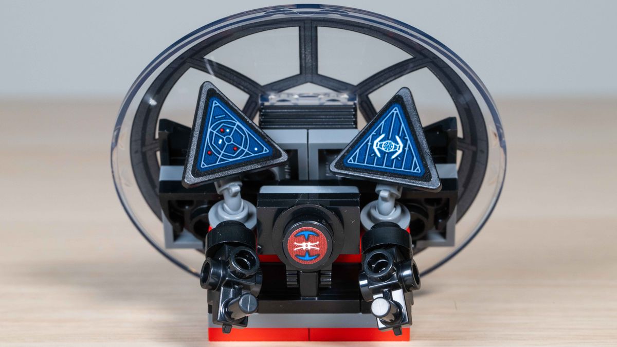 Lego TIE Interceptor cockpit control panel and window removed from model and photographed separately