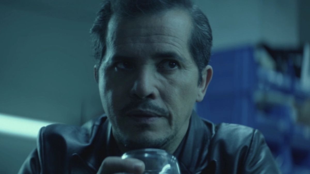 John Leguizamo&#039;s Aurelio hold glass filled with alcohol while talking with John Wick