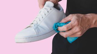 cleaning trainers with a cloth