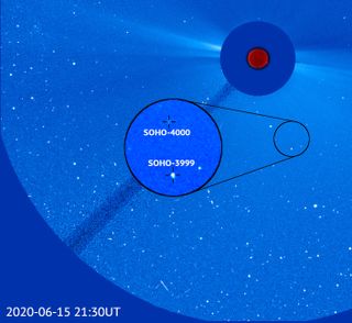 An image taken by the SOHO spacecraft on June 15, 2020, shows two newly discovered sungrazing comets, including the 4,000th such object discovered by the solar spacecraft.