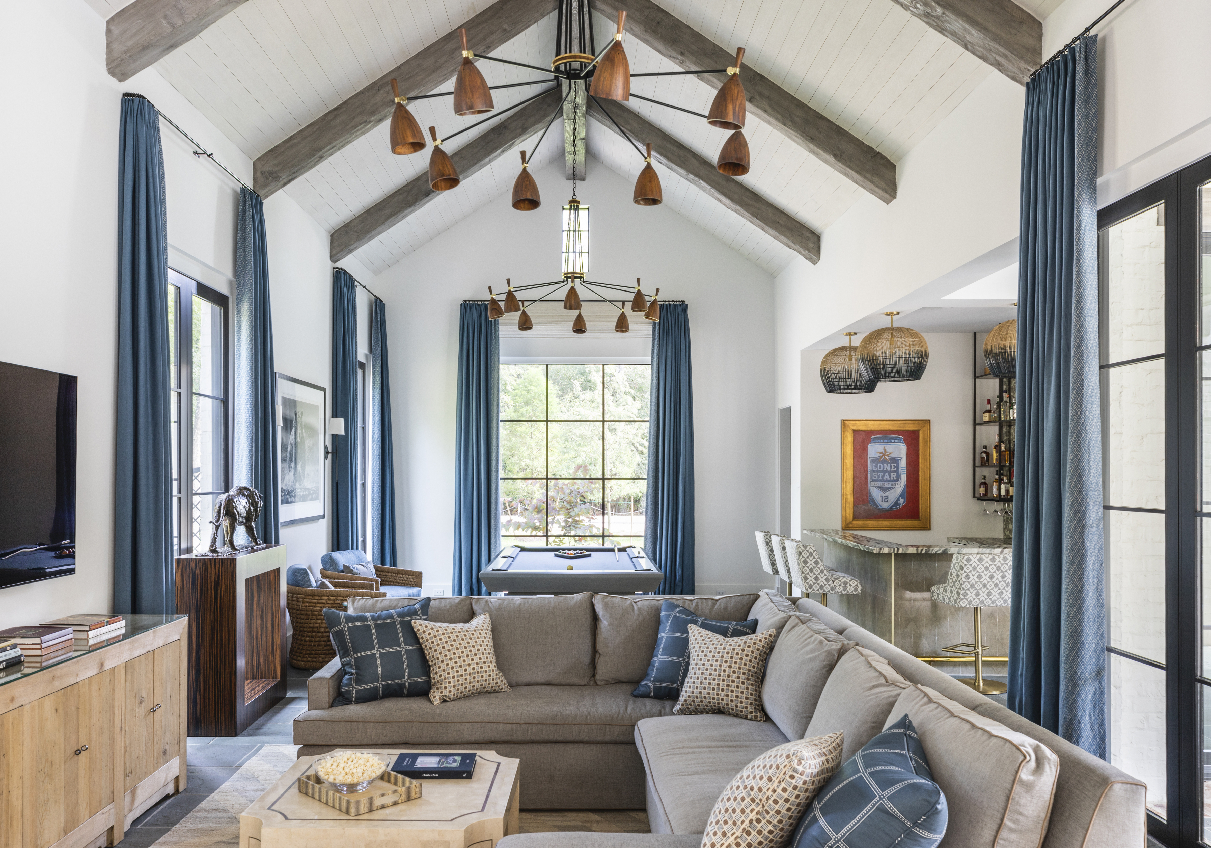 living room with vaulted ceiling and L-shaped sofa