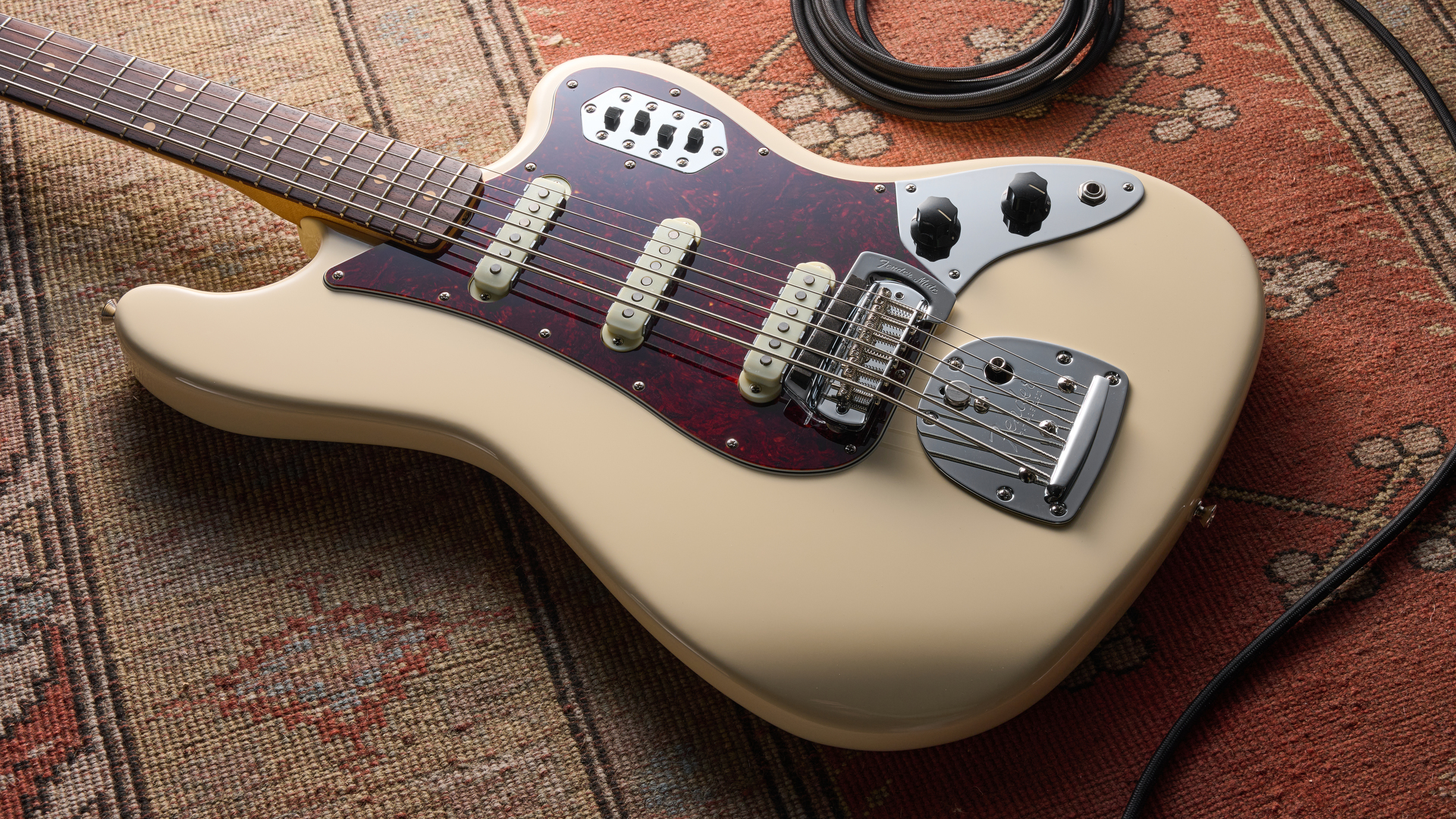 Fender Vintera III Early '60s Bass VI in Olympic White with red tortoiseshell pickguard.