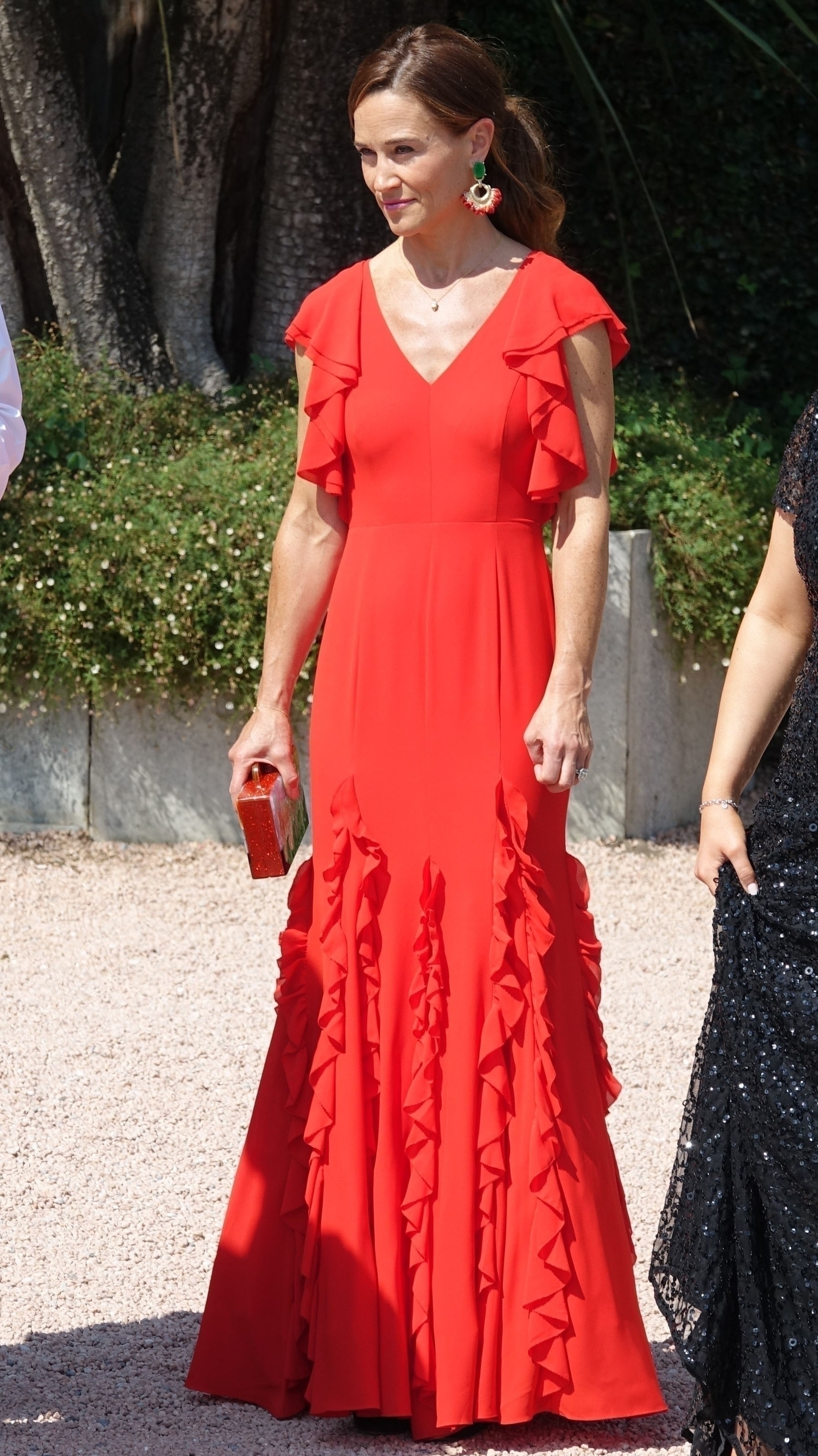 Pippa Middleton wearing a red Phase Eight dress at a wedding in 2023