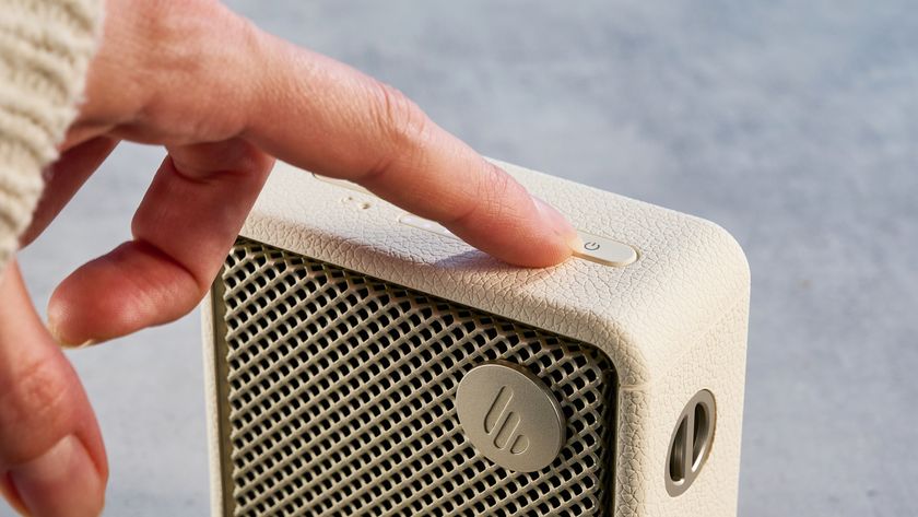 Edifier ES20 Bluetooth speaker in ivory colorway photographed on a blue background
