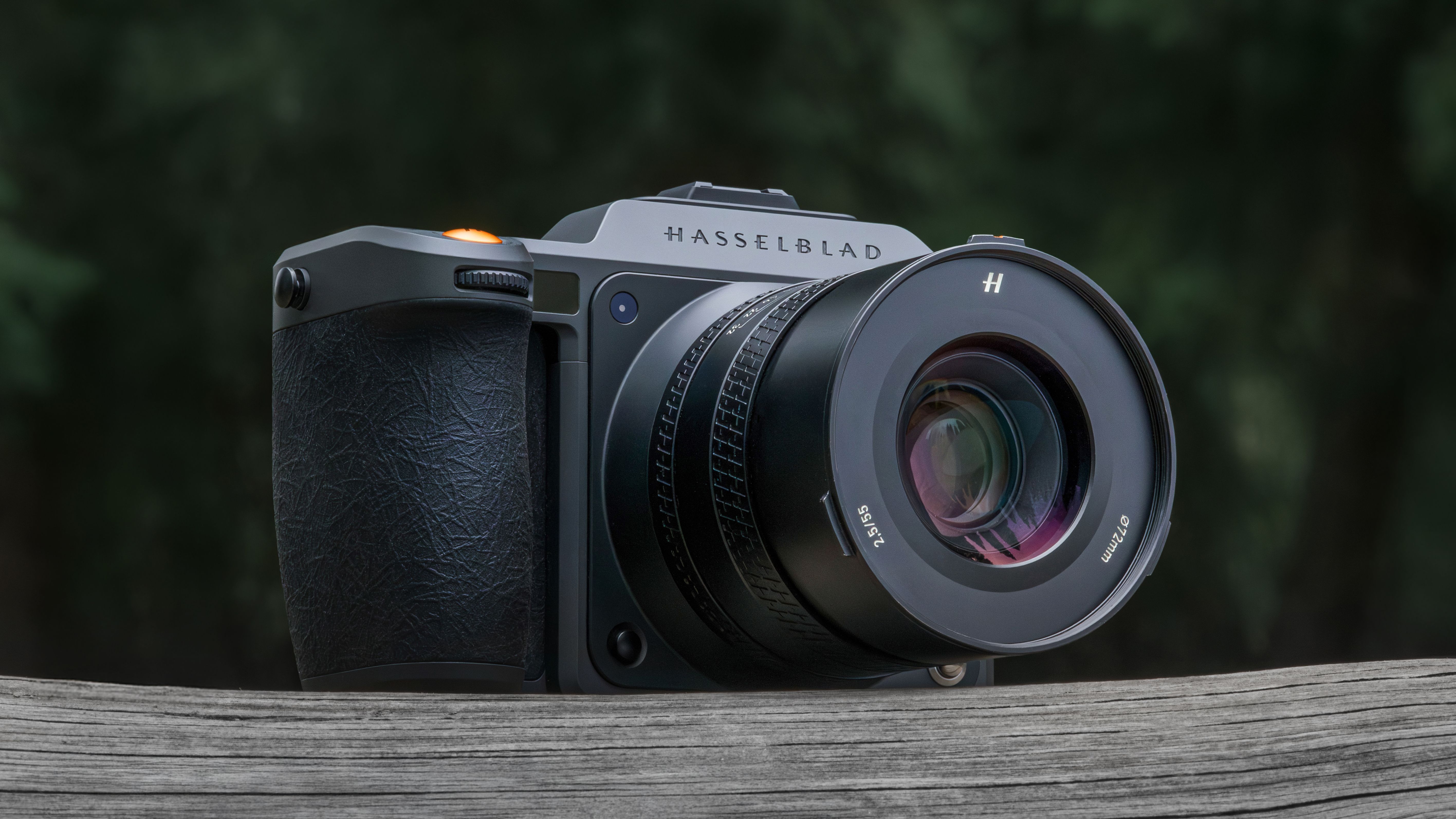 Hasselblad X2D II 100C on a wooden surface outdoors