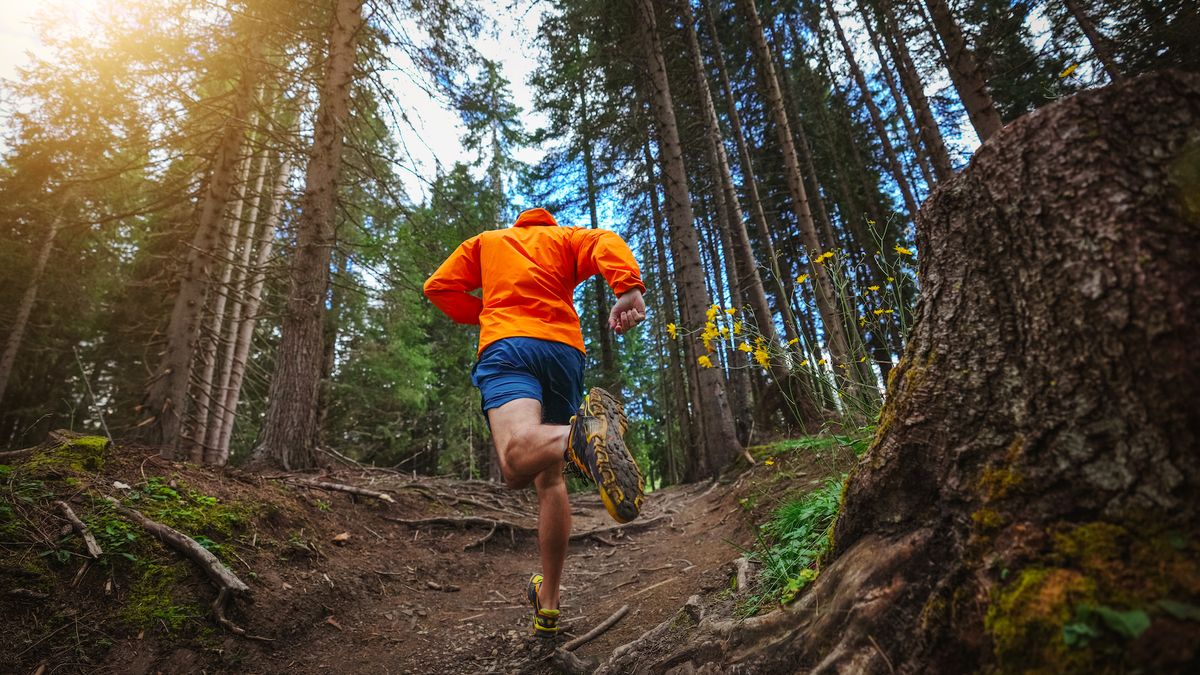 Man trail running on Dolomites high mountain