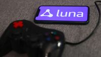 Luna logo displayed on a phone screen and a gamepad are seen in this illustration photo taken in Krakow, Poland on September 29, 2022. 