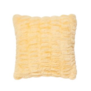 A yellow fluffy pillow