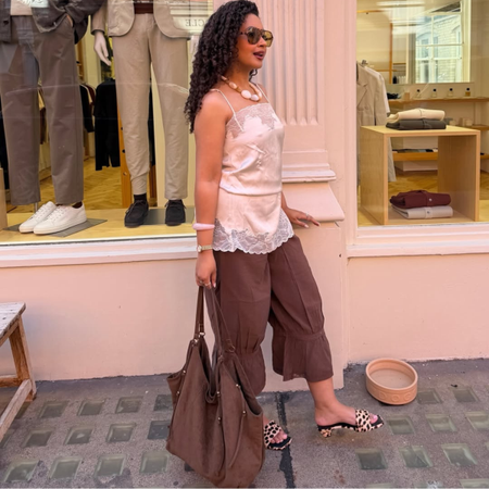 Influencer Layla Abbey wearing a lace camisole, bloomers and mule sandals. 