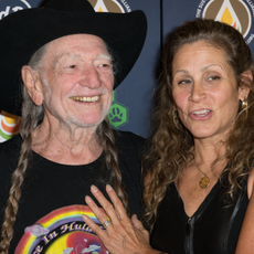 Willie Nelson and Annie D'Angelo attend Hard Rock International's Wille Nelson Artist Spotlight Benefit Concer at Hard Rock Cafe, Times Square on June 6, 2013 in New York City