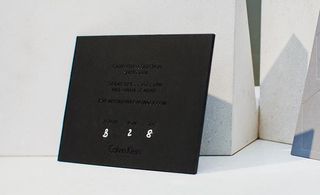Black invitation card with white typing