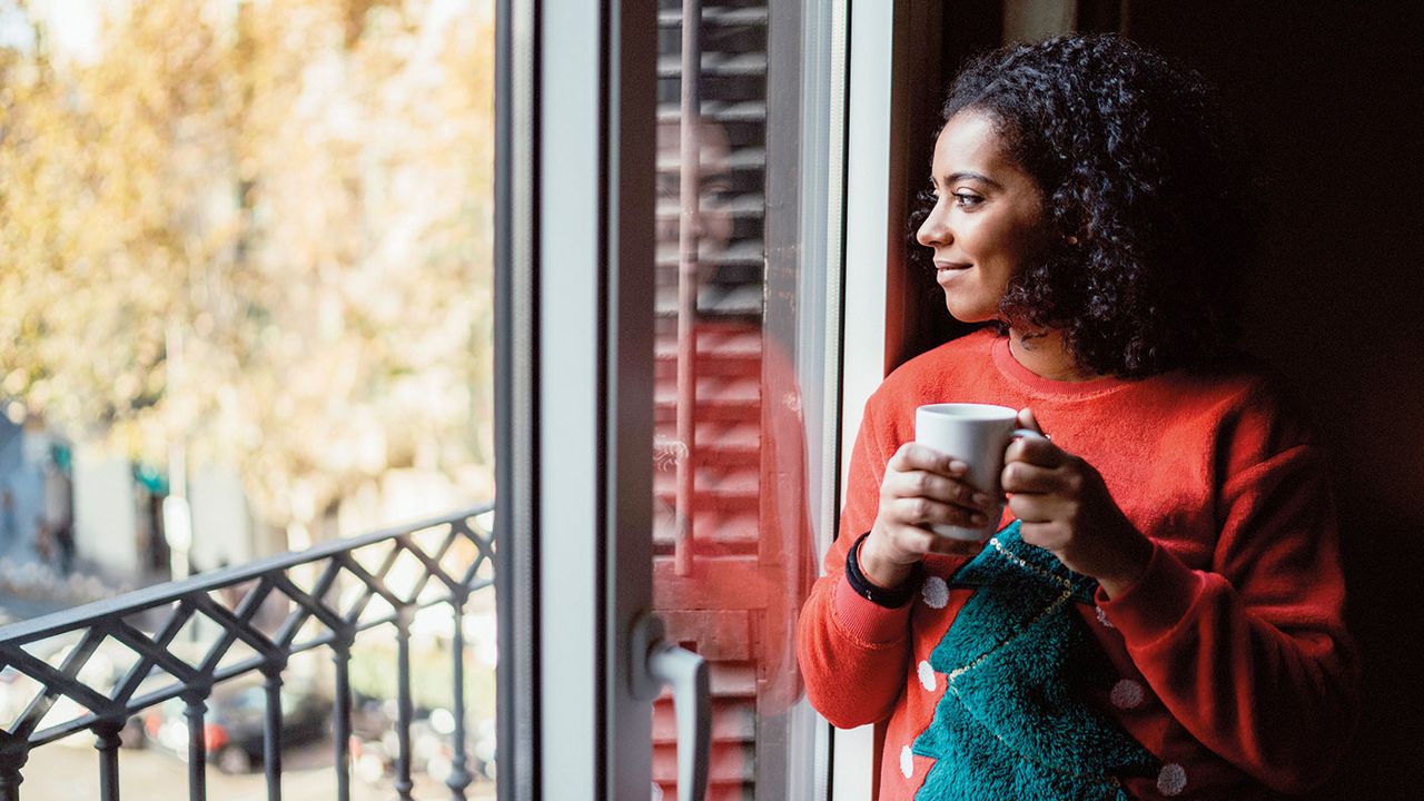 Woman looking out of a window