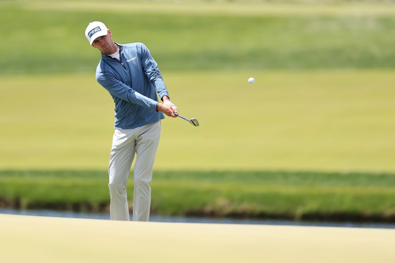 Alex Smalley chips onto the 17th green during the second round of the PGA Championship at Aronimink Golf Club
