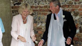 Camilla and Charles laughing and tiling.