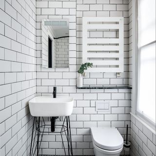 bathroom with white tiles wall
