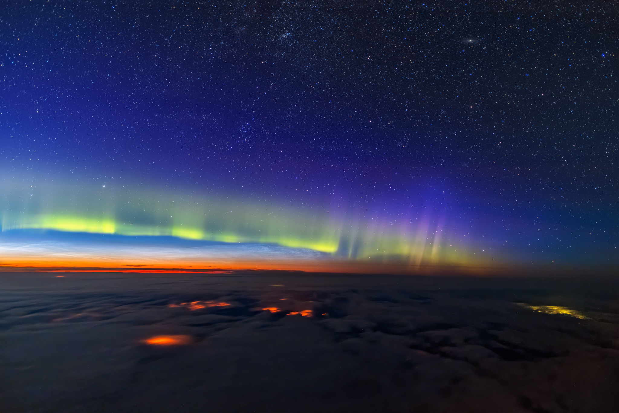 A photograph taken by pilot Ralf Rohner of the aurora above the clouds