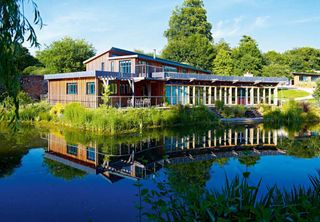 A contemporary oak-framed lakehouse on a stunning conservation area plot