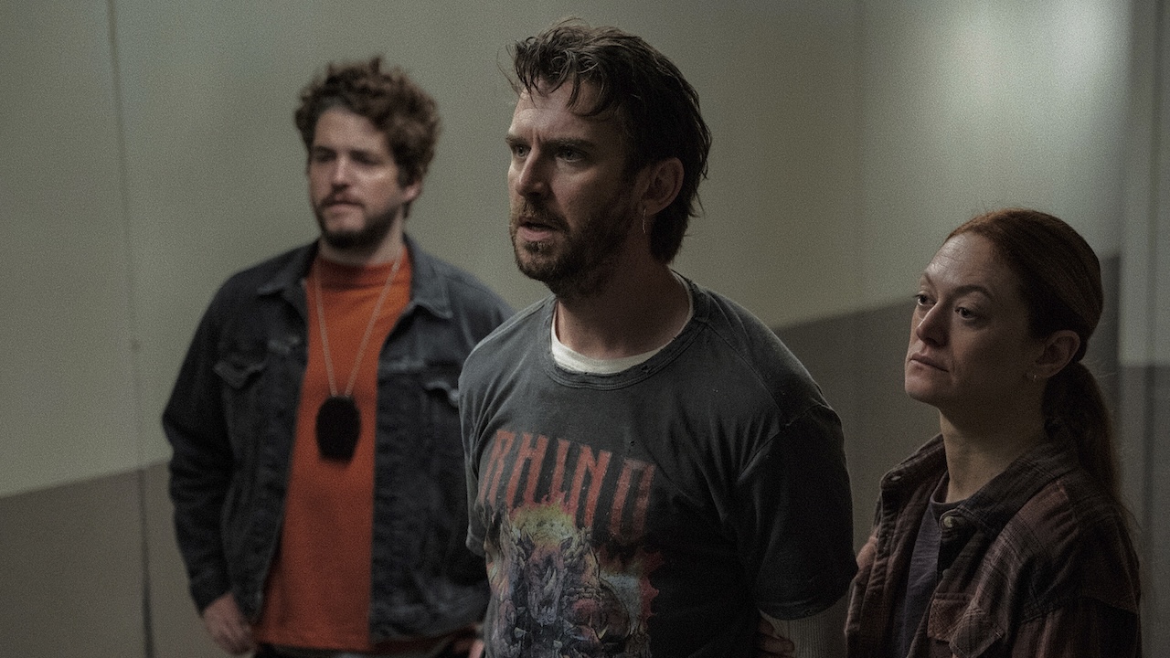 Dewey taking a handcuffed Pepper down a hall in The Terror: Devil in Silver