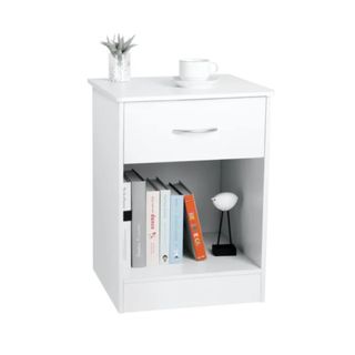A white nightstand with books underneath it