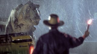 Scene from the movie Jurassic Park. Here we see an overturned car in the rain. A T-rex is approaching a man holding a flare.