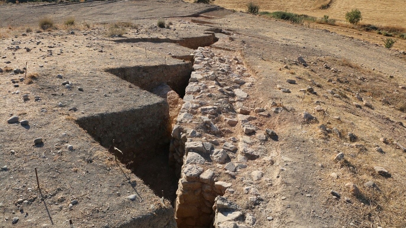 Broken rampart hidden under an ancient burial ground in Cyprus.