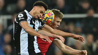 Scott McTominay fights with Jacob Murphy to head the ball