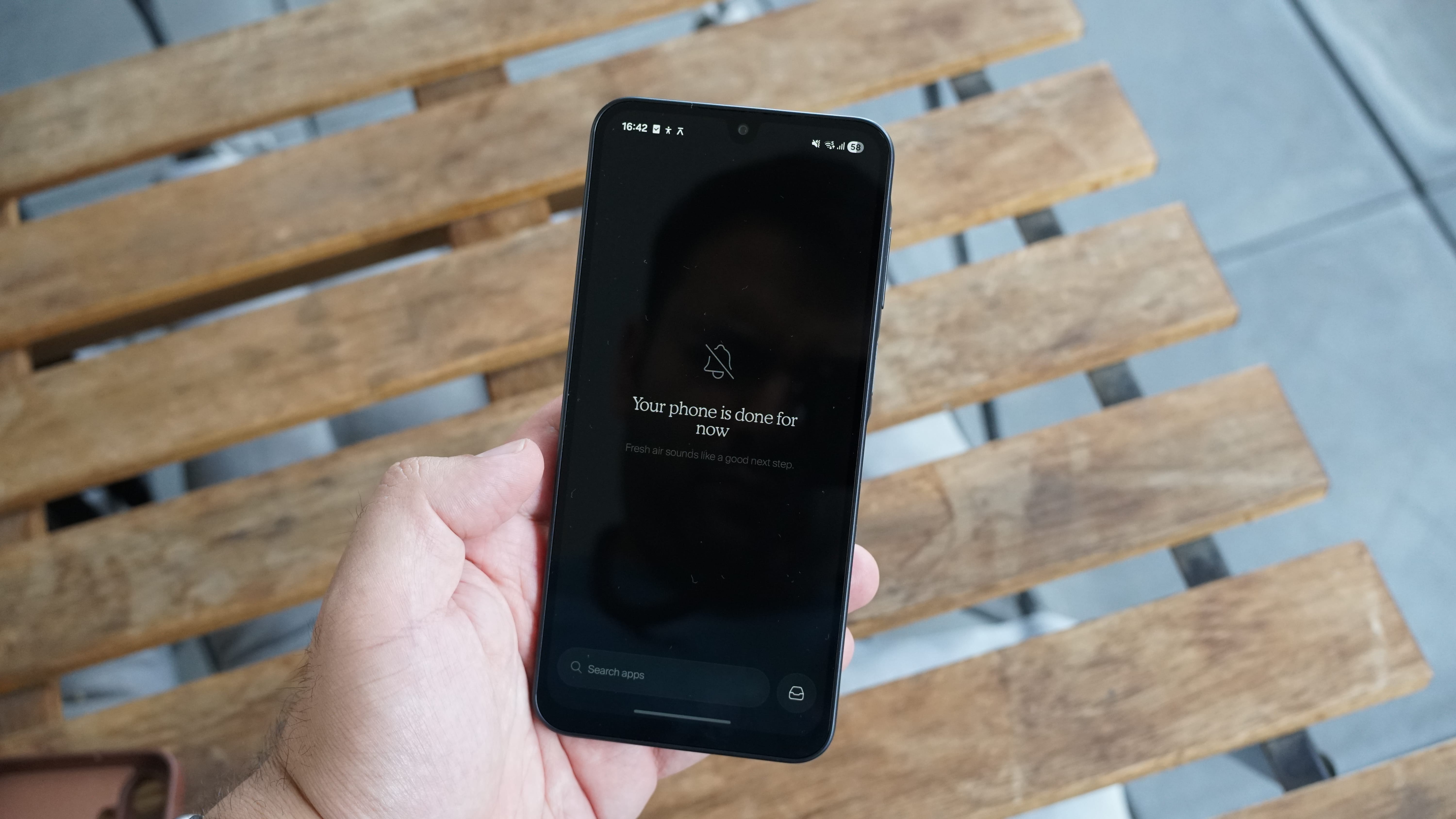 The Balance Phone being held in the hand