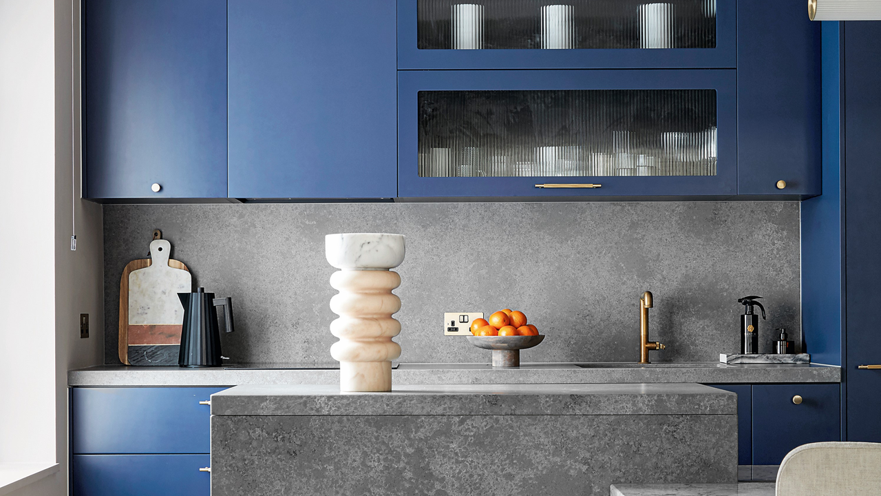 blue kitchen cabinets with granite benchtop