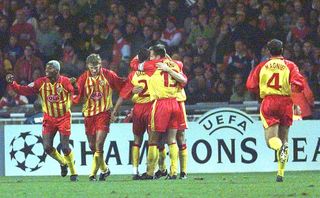 Lens players celebrate a goal against Arsenal in the Champions League in 1998.