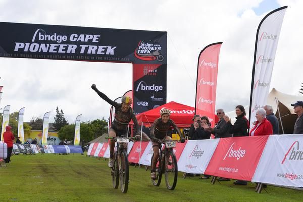 Alice Pirard and Catherine Williamson celebrate winning the stage and claiming the overall lead on Stage 4