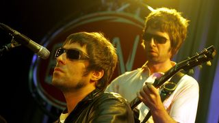Liam and Noel Gallagher of Oasis perform live onstage
