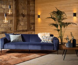 living room with wood and stone walls