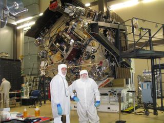 Juno spacecraft is being prepped for Jupiter at Lockheed Martin Space Systems. Bunny-suited Jack Farmerie, Lockheed Martin's lead spacecraft technician on the Juno project (left) and SPACE.com reporter Leonard David.