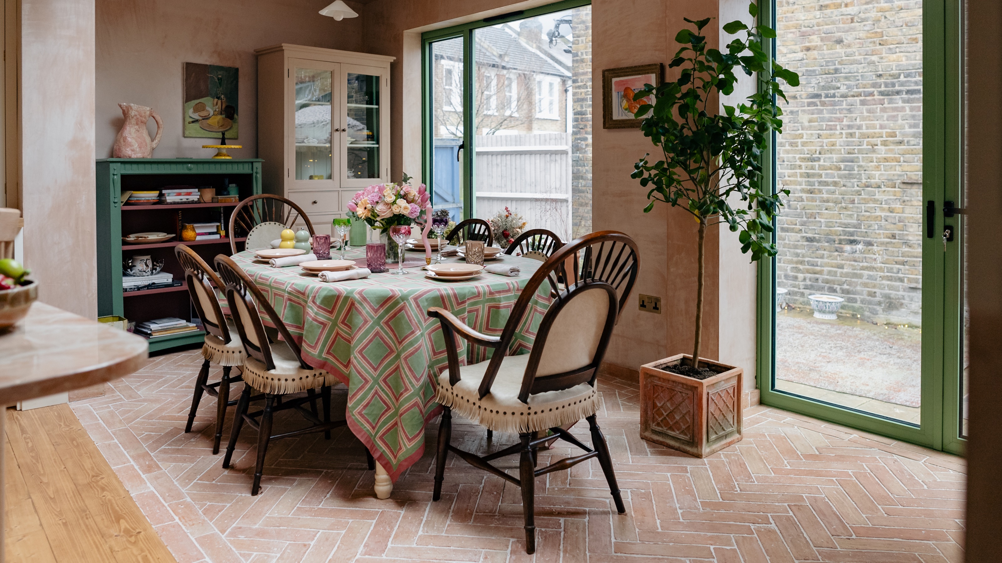 kitchen diner with terracotta tile flooring and modern heritage styling 