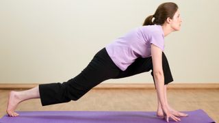 Woman doing low lunge yoga pose
