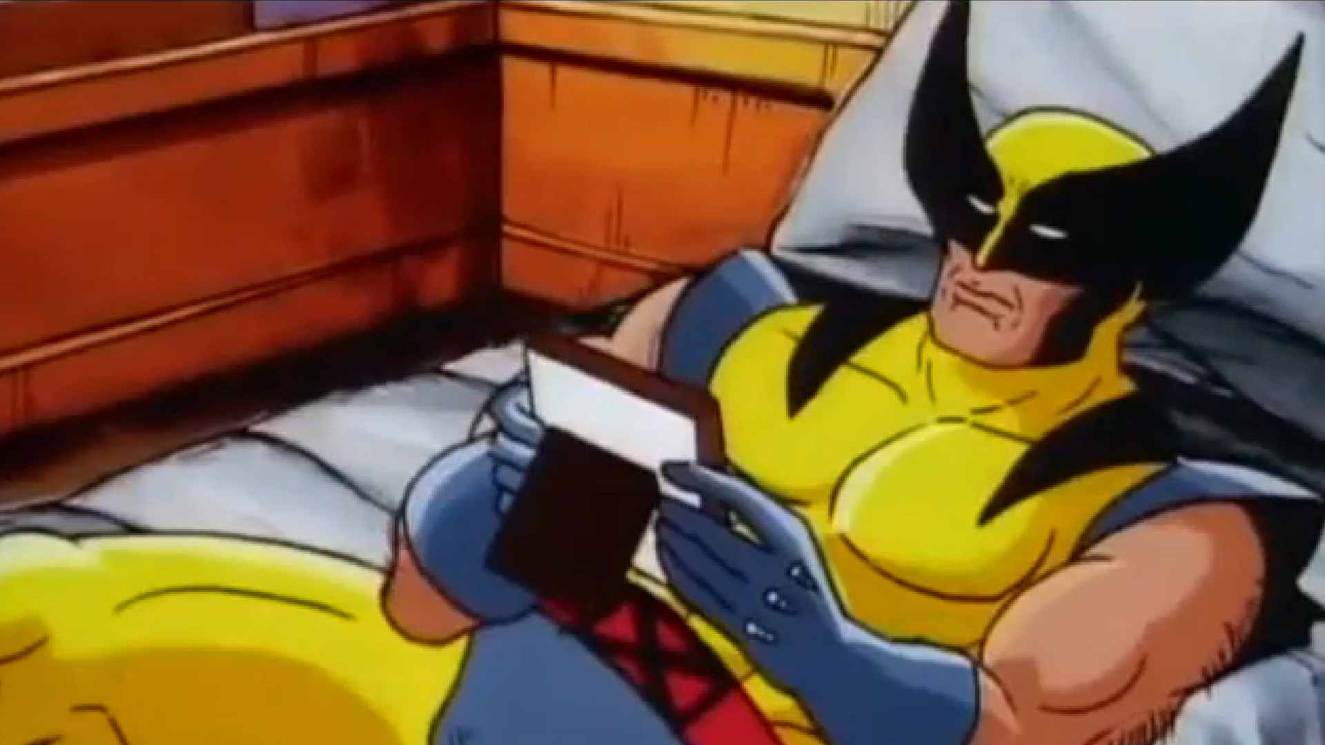 Wolverine stares longingly at a photo in X-Men: The Animated Series
