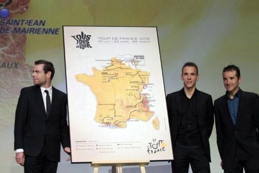 2011 Tour de France champion Cadel Evans, Philippe Gilbert and Thomas Voeckler on stage with a 2012 Tour de France route map.