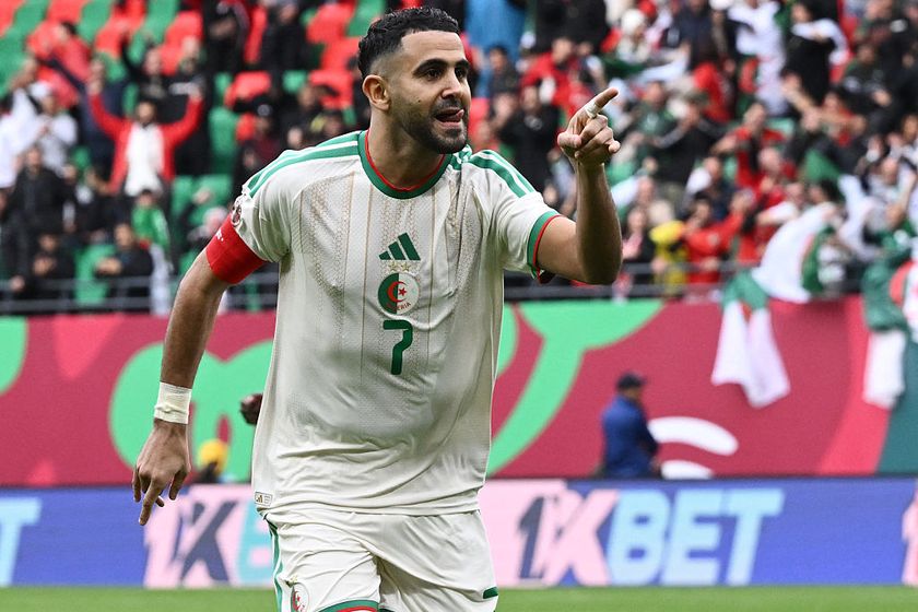 Algeria's forward #7 Riyad Mahrez celebrates scoring the team's first goal during the Africa Cup of Nations (CAN) Group E football match between Algeria and Sudan at Moulay Hassan Stadium in Rabat on December 24, 2025. (Photo by SEBASTIEN BOZON / AFP)