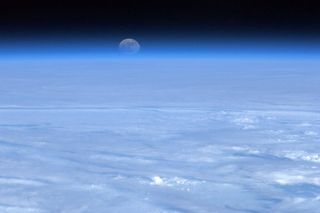 Clouds and Moon Seen from the International Space Station
