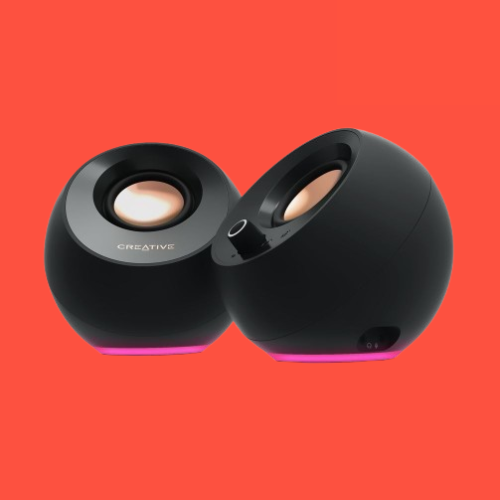 The Creative Pebble Pro speakers on a red background