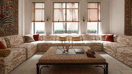 Dedar-upholstered sectional sofa and coffee table pictured in the living room of an Upper East Side townhouse
