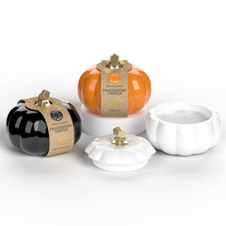 three pumpkin shaped ceramic candles, One white, one is orange and one is black.