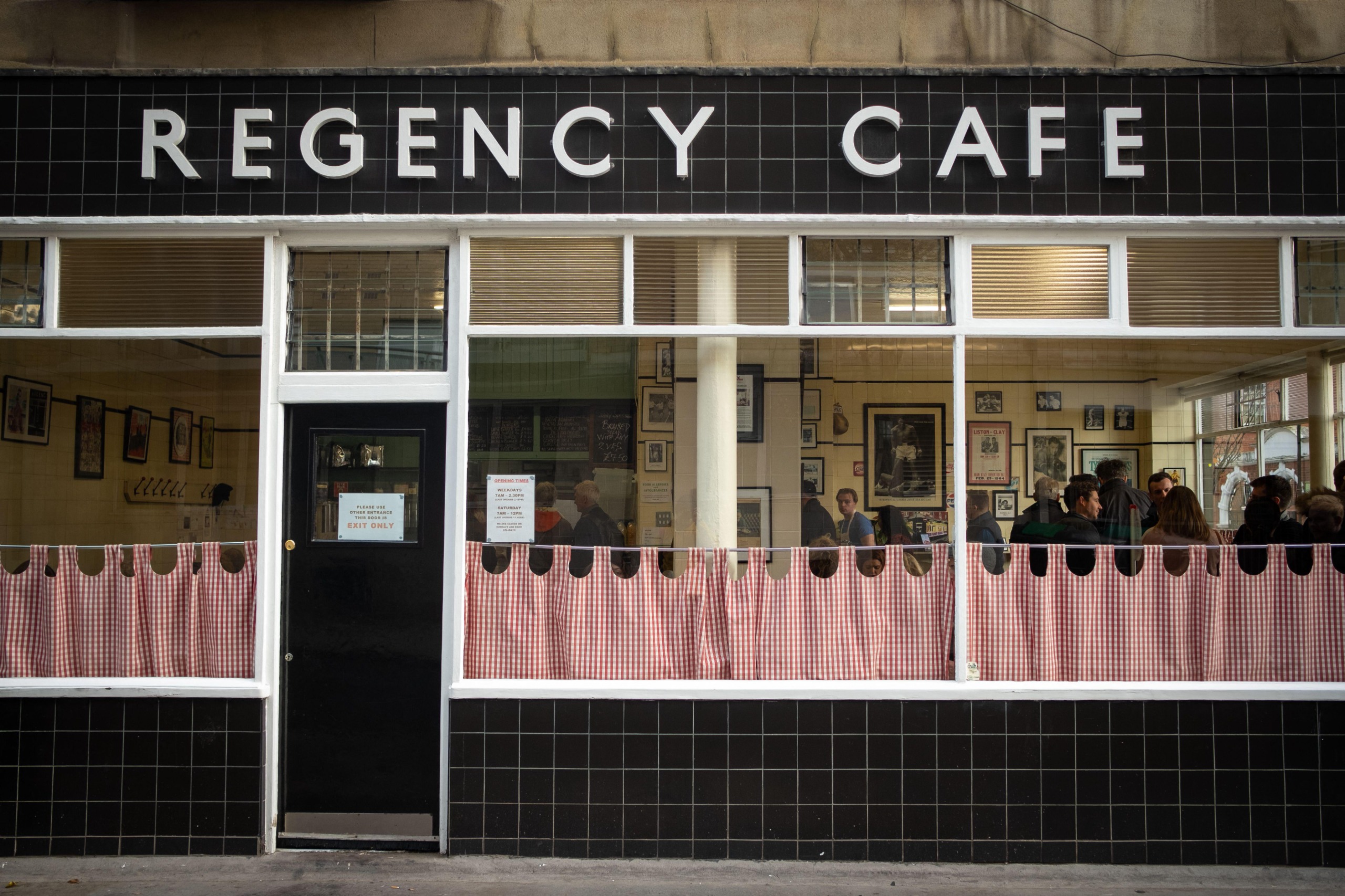 The black-tiled facade of the Regency Cafe in SW1.