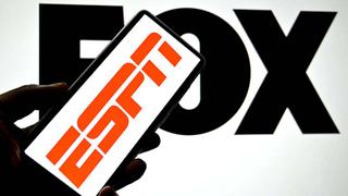 INDIA - 2025/04/16: In this photo illustration, an ESPN logo is seen displayed on a smartphone with a FOX logo in the background. (Photo Illustration by Avishek Das/SOPA Images/LightRocket via Getty Images)