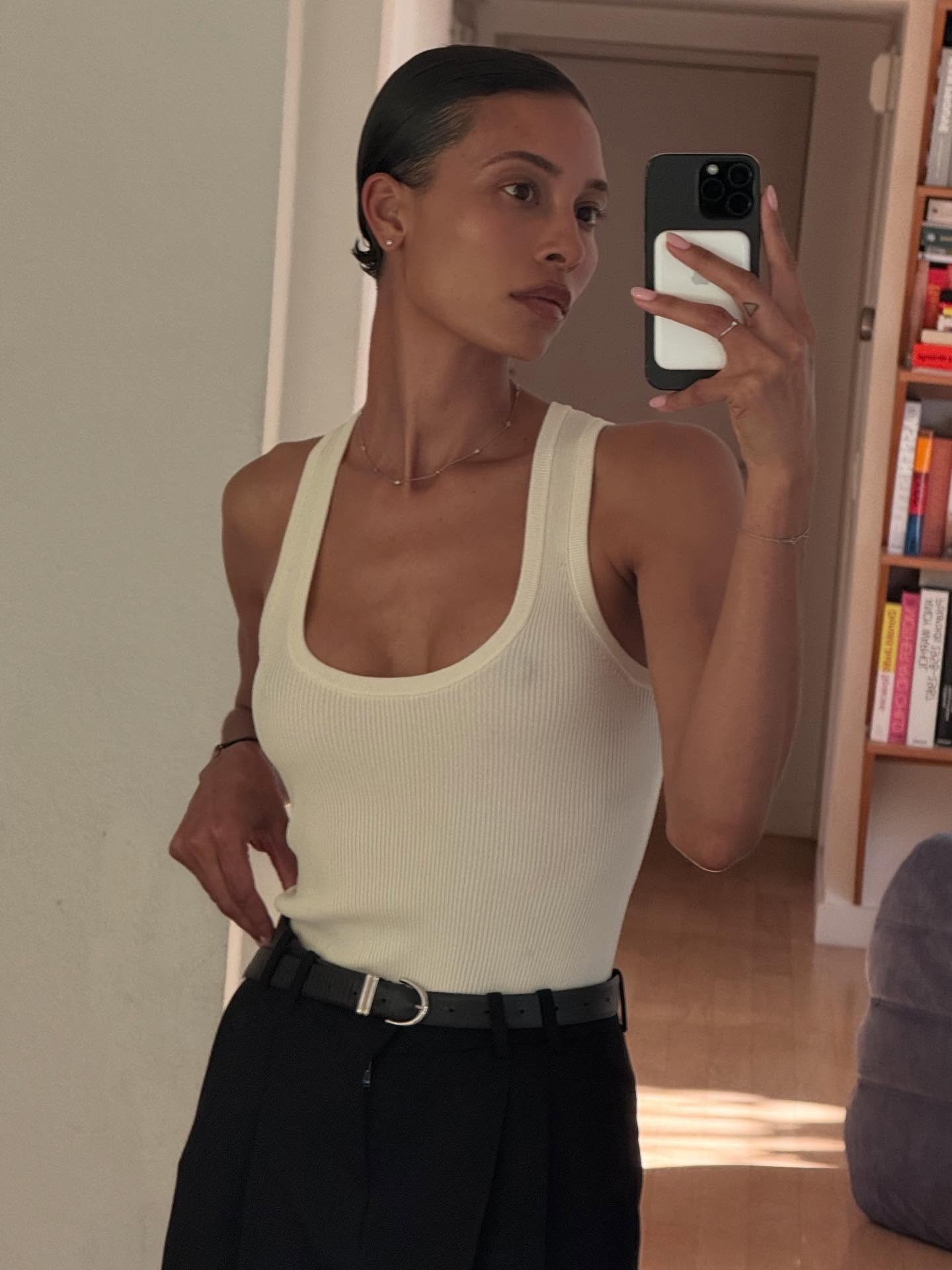 A woman with a slicked-back mullet bob hairstyle