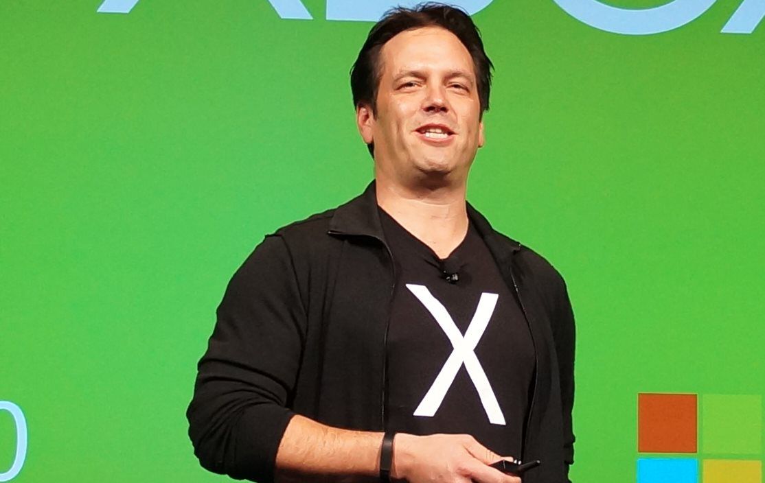 phil spencer on green background wearing hoodie with an x on it
