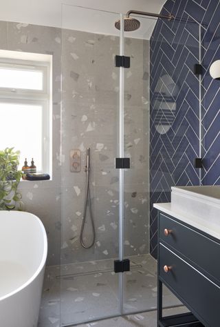 bathroom with blue and gray wall tiles
