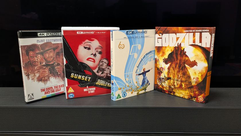 Photo of 4 4K Blu-rays, Sunset Boulevard, Godzilla, The Sound of Music and Seven Samurai, in front of a TV 